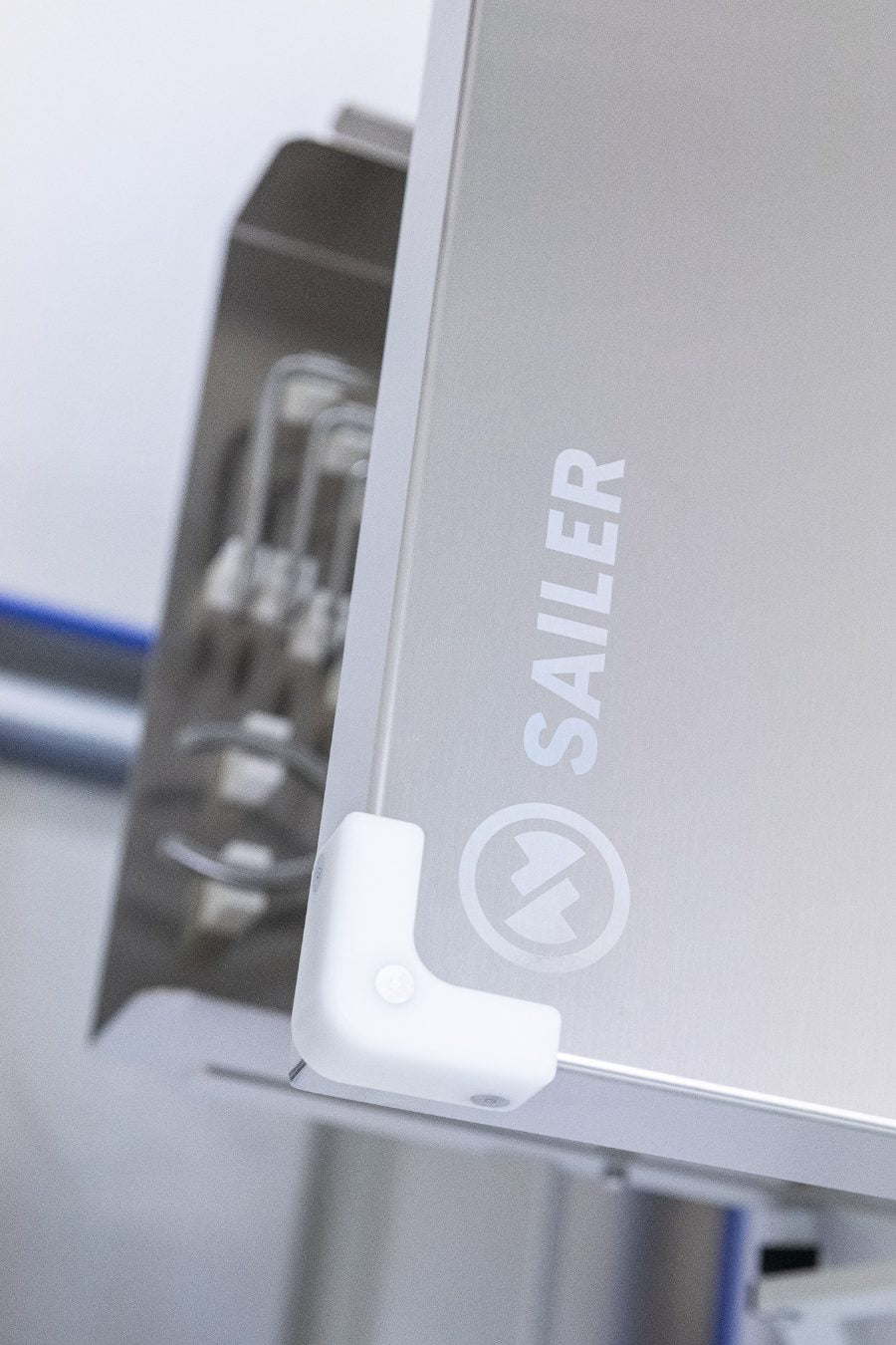Pharmaceutical equipment panel with a flush-fastened corner bracket