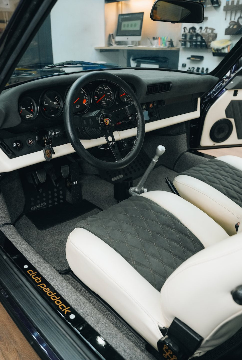 Restored Porsche interior; flush fasteners on the sill plate